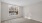 an empty bedroom with a window