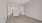 an empty bedroom with carpet