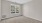 an empty bedroom with carpet