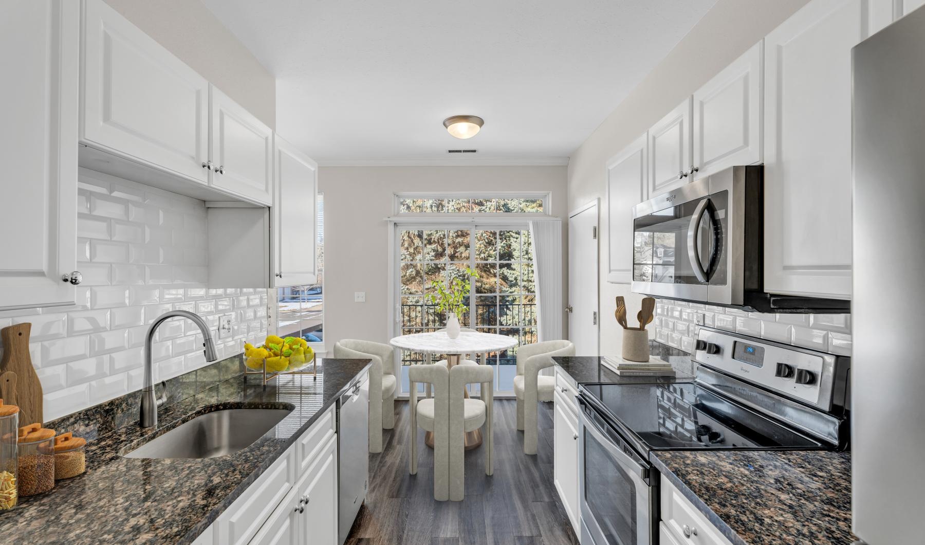 a kitchen with white cabinets