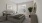 a bedroom with a bed and a plant
